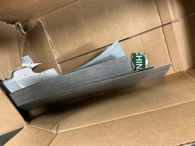 Condition photo showing As Is for Peel and Stick Vinyl Flooring 36 Pack 54 Sq.Ft, Waterproof Vinyl Flooring Peel and Stick for Office, Living Room, Bathroom, Kitchen - Unique Design Easy to Install Floor, Dark Gray 36 x 6 x 0.1 inches Dark Gray 36