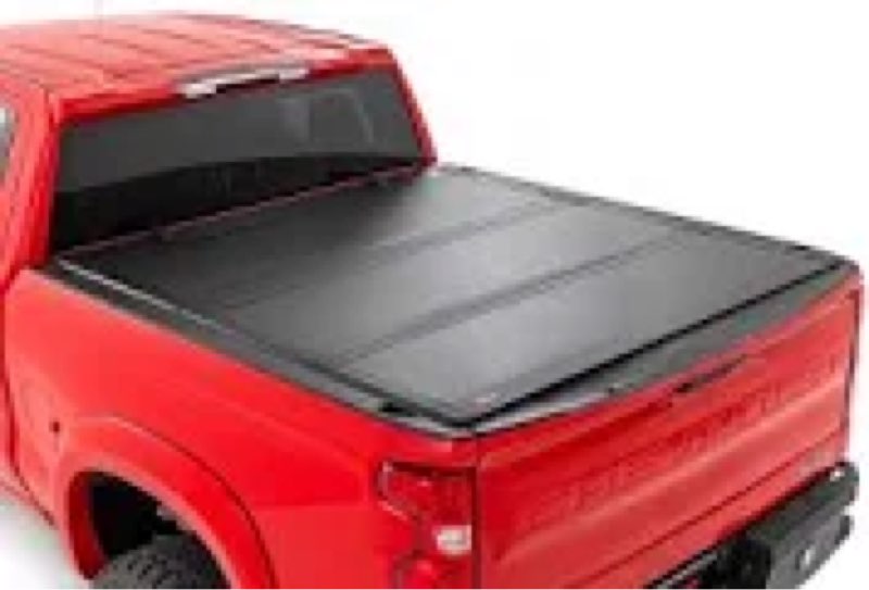 Rough country  hard tri fold flip up bed cover for,trucks w/o in bed rails