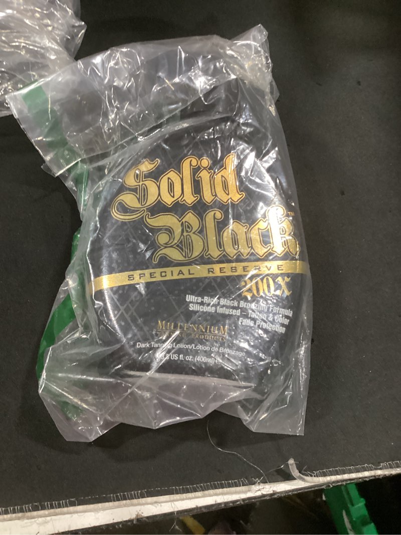 Condition photo showing Good Condition for millennium tanning solid black special reserve 200x, tanning lotion w/tattoo protector, 13.5 ounces
