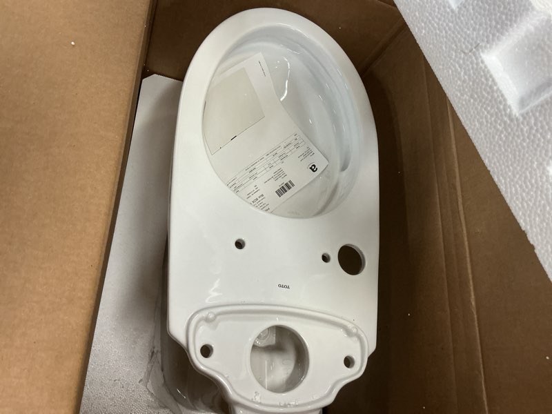Condition photo showing New/Like New for toto® drake® two-piece elongated 1.28 gpf universal height tornado flush ® toilet with 10 inch rough-in, cefiontect®, and softclose® seat, washlet®+ ready, cotton white - ms776124cefg.10#01