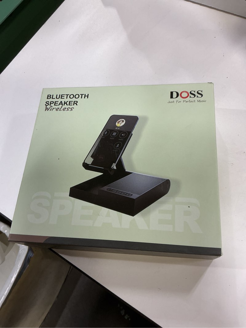 Condition photo showing New/Like New for DOSS Cell Phone Stand with Bluetooth Speaker, 15W Wireless Charger and Anti-Slip Base,4-in-1 Function, 8H Playtime, Hands-Free, Adjustable Holder, Compatible with Tablet
