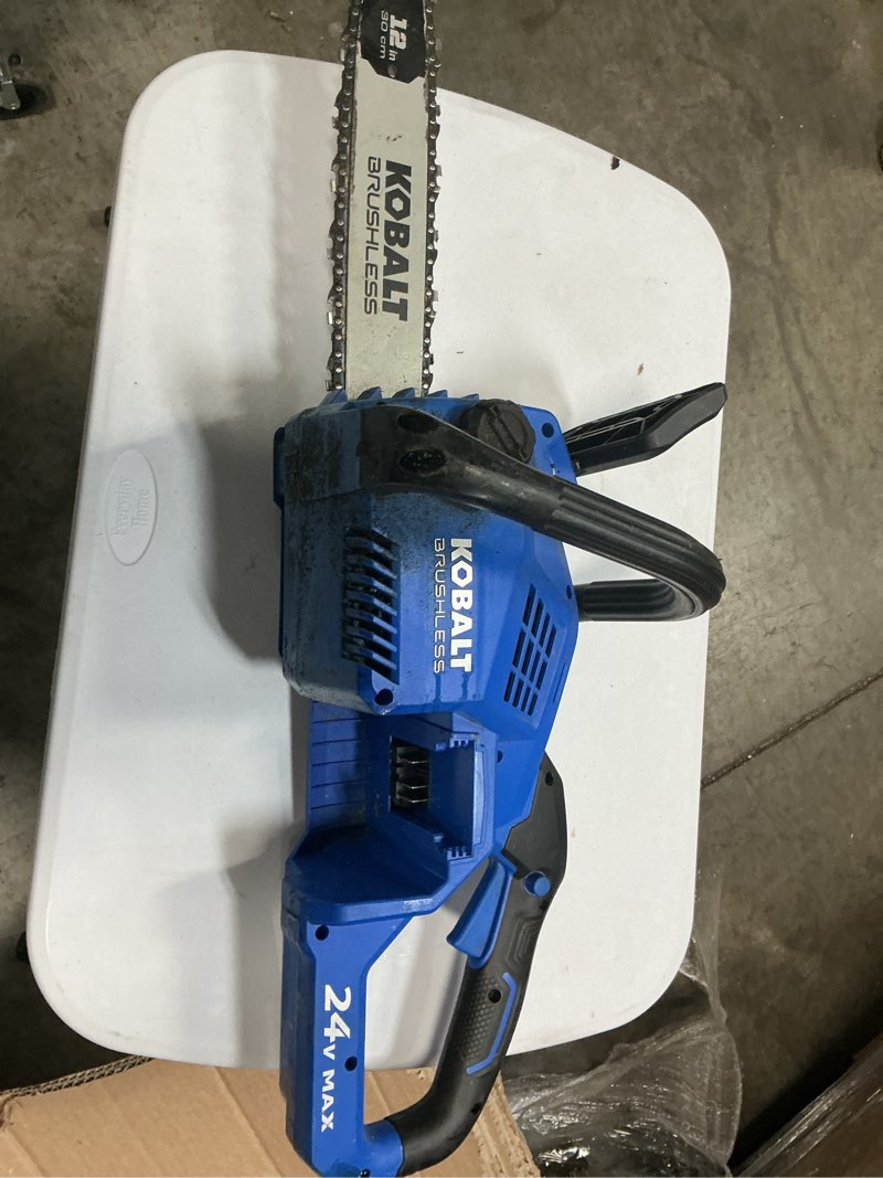 Condition photo showing As Is for 24 volt kobalt chainsaw electric NEW (battery/charger not included)