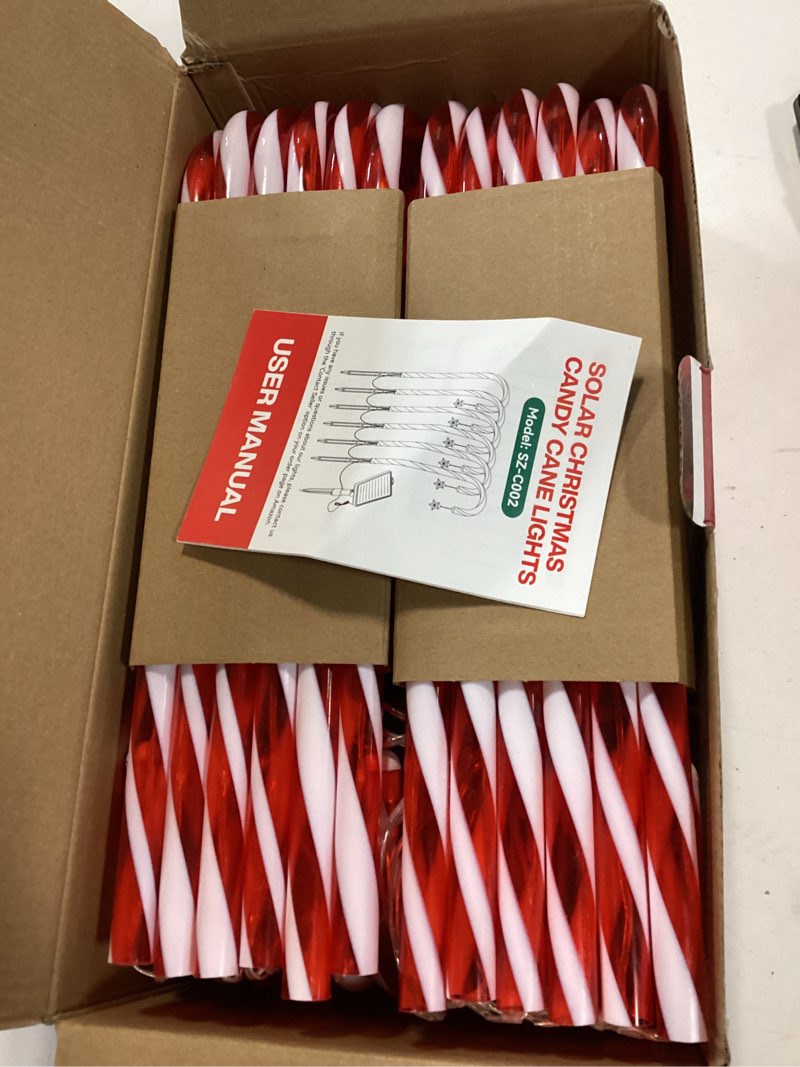 Condition photo showing Good Condition for Solar Christmas Lights Outdoor Decorations: 24-Pack Candy Cane Pathway Lights with 10 Modes - Unique Xmas Gifts for Mom Women - Waterproof Decorative Christmas Yard Stakes for Holiday Garden Decor 24 Pack