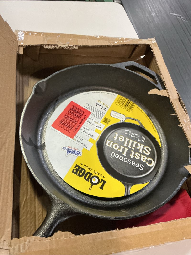 Condition photo showing New/Like New for Lodge Cast Iron Skillet with Red Silicone Hot Handle Holder, 12-inch