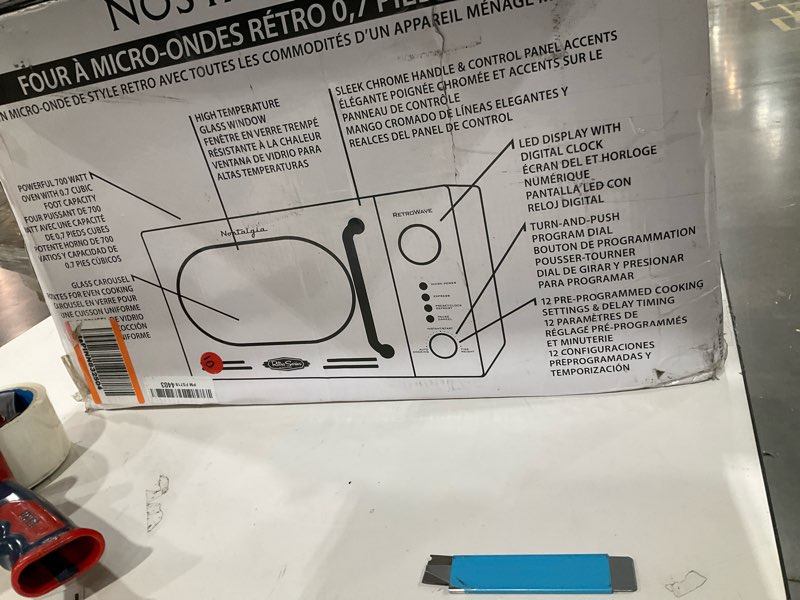 Condition photo showing As Is for Nostalgia Retro Compact Countertop Microwave Oven - 0.7 Cu. Ft. - 700-Watts with LED Digital Display - Child Lock - Easy Clean Interior - Pink Retro Classic 0.7 Cu. Ft. Pink