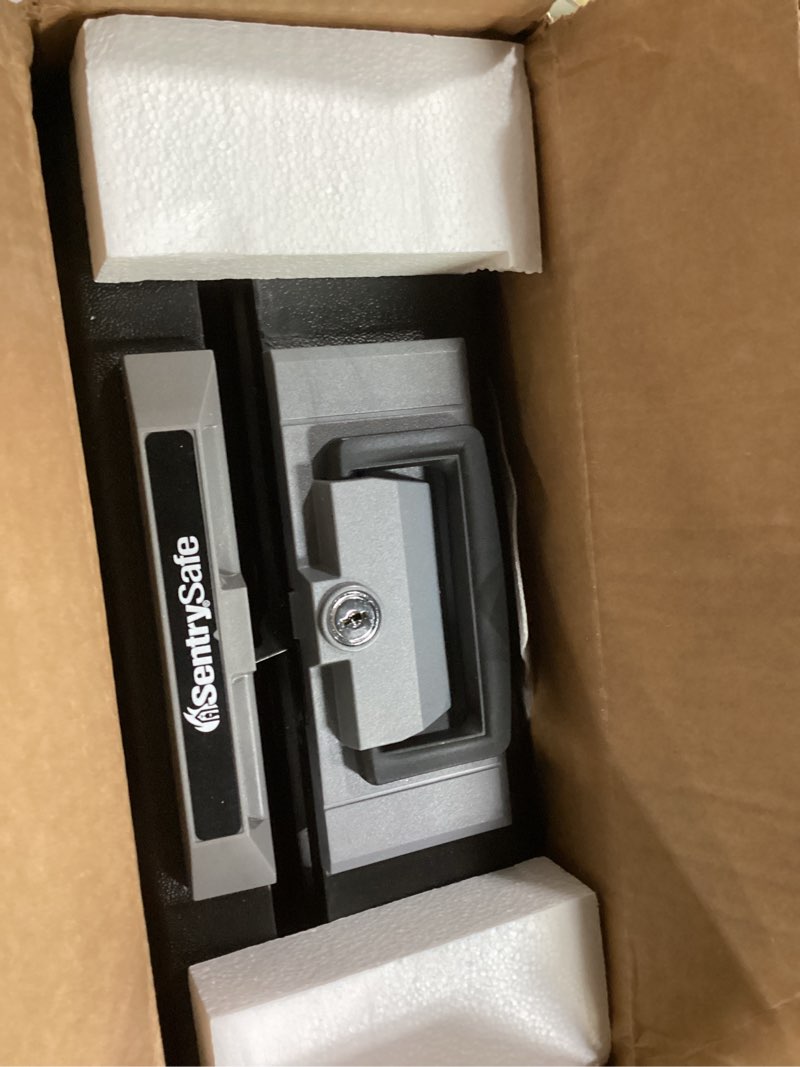 Condition photo showing Good Condition for SentrySafe Fireproof Safe Box with Key Lock, Chest Safe with Carrying Handle to Secure Money, Jewelry, Documents, 0.25 Cubic Feet, 6.3 x 15.3 x 12.1 Inches, 1160 Fire resistant box 0.25 cu. ft.