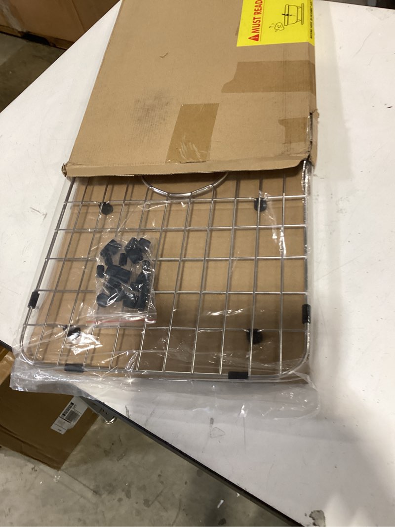 Condition photo showing As Is for serene valley sink bottom grid 24-1/8" x 12-5/8", centered drain with corner radius 1-1/2", sink protector nlw2412c