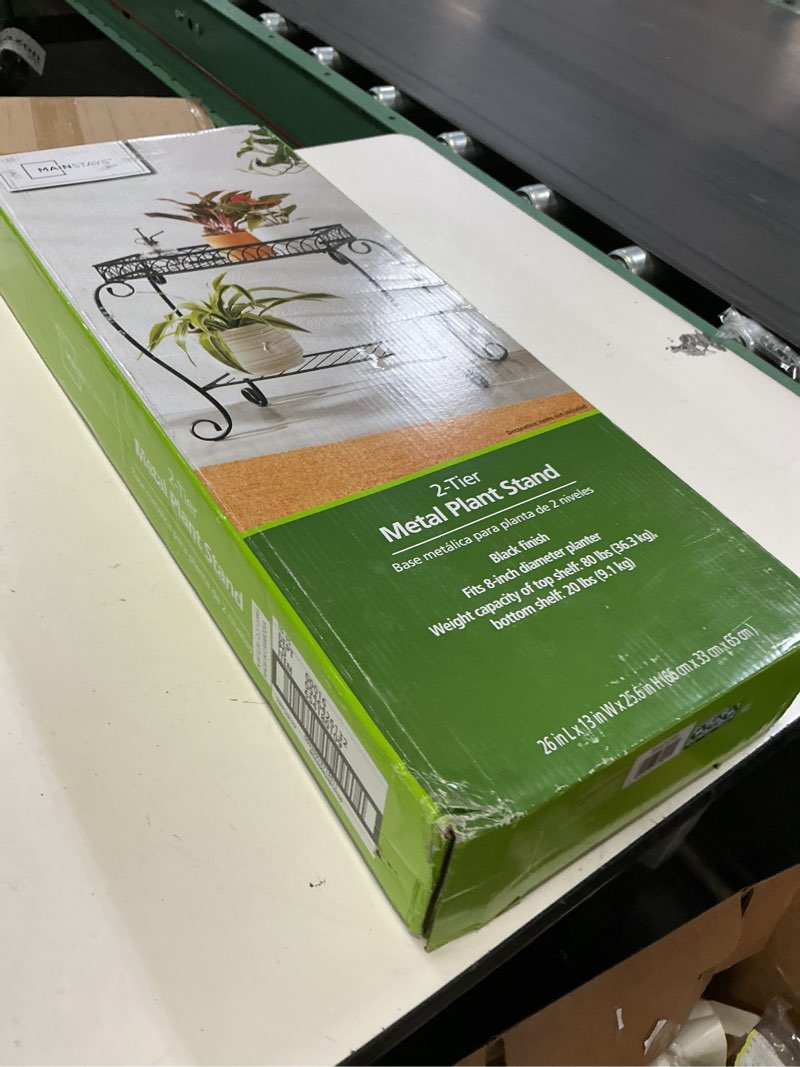 Condition photo showing New/Like New for mainstays black metal 2 tier shelves plant stand