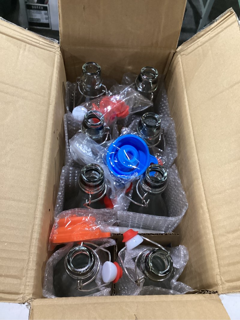 Condition photo showing New/Like New for 8 pack [1 l / 33 fl. oz.] swing top glass bottles w/ airtight stopper lids – flip top brewing bottle for fermentation, kombucha, mead, vinegar, beer, kefir, wine, soda – with 8 extra seals & 2 pourer