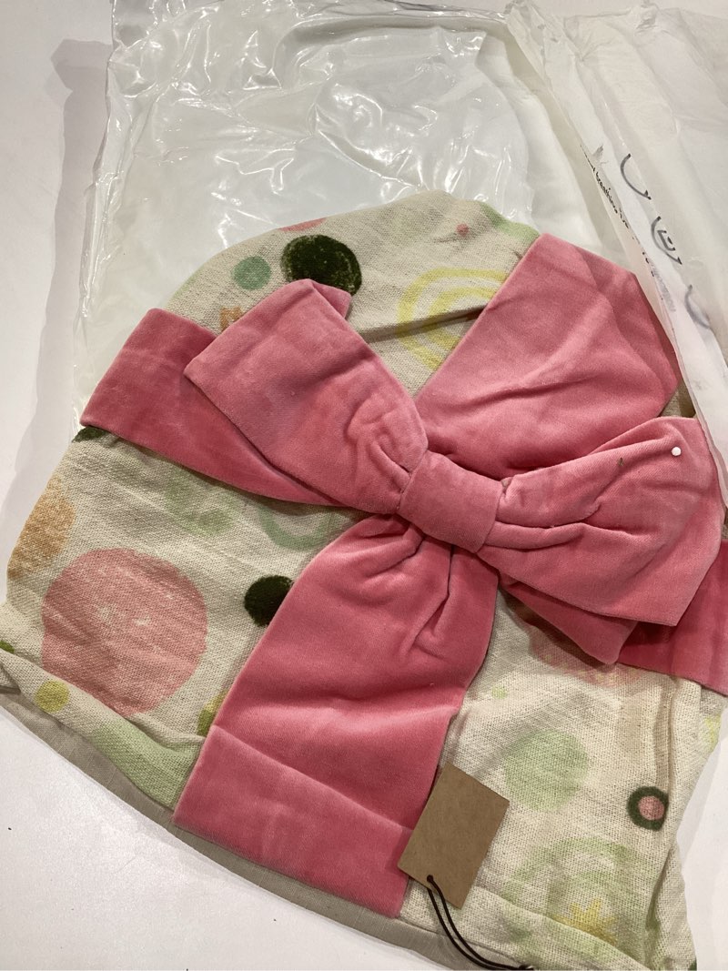 Condition photo showing New/Like New for Creative Co-Op Square Cotton Printed Pillow with Pattern and Velvet Applique Bow, Multicolor