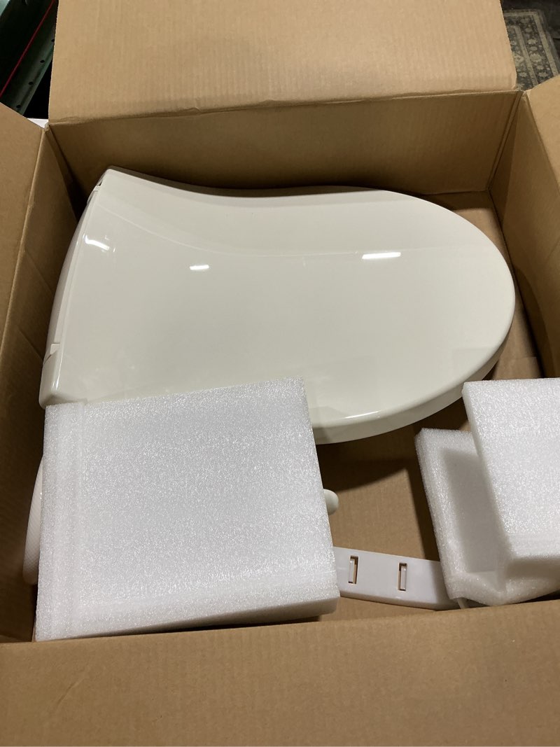 Condition photo showing As Is for kohler purewash m250 manual bidet toilet seat, round & low profile, non- electric, adjustable water pressure, self cleaning, quiet-close, easy installation, biscuit biscuit round