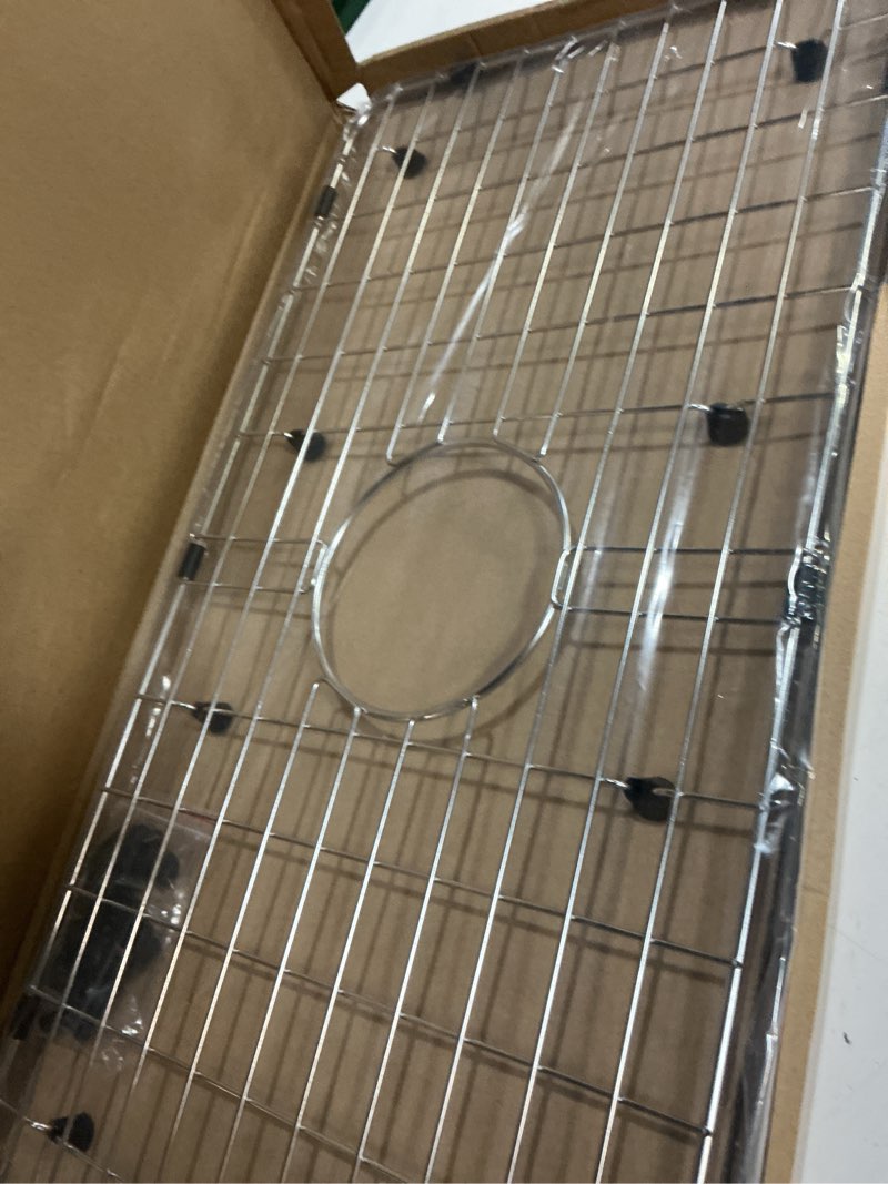 Condition photo showing Good Condition for serene valley 25-1/8" x 12-7/8" sink grid, centered drain with corner radius 1-1/2", nlw2513c