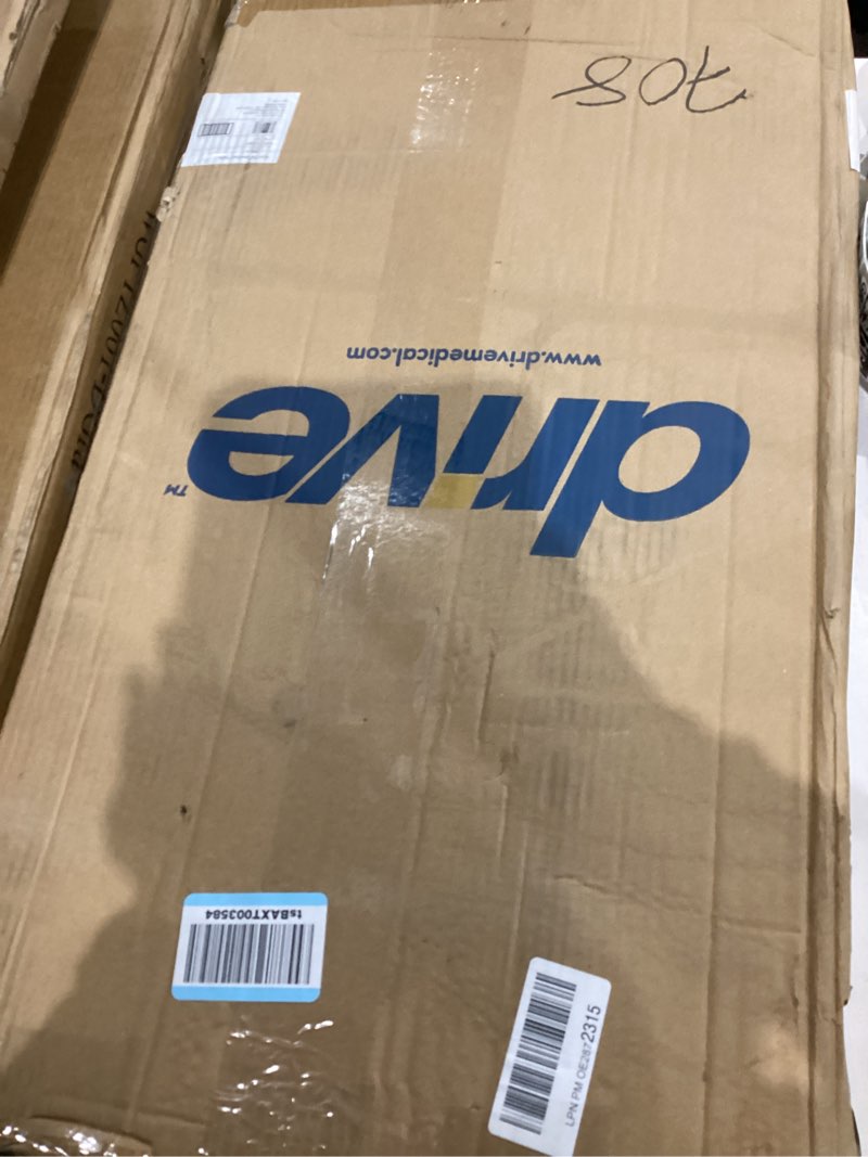 Condition photo showing New/Like New for Drive Medical Overbed Table with Wheels - Secure Height Adjustment for Comfort - Non Tilt Surface - Smooth Rolling Design - Home & Hospital Use - Woodgrain Laminate Top - Silver Vein Silver Vein Table