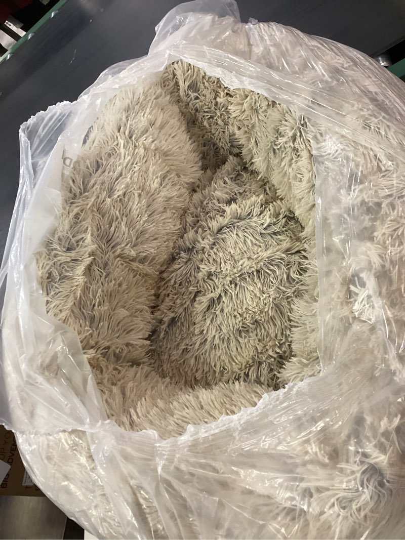 Condition photo showing As Is for Furhaven 30" Round Calming Donut Dog Bed for Medium/Small Dogs, Refillable w/ Removable Washable Cover, For Dogs Up to 45 lbs - Shaggy Plush Long Faux Fur Donut Bed - Taupe, Medium Medium Taupe