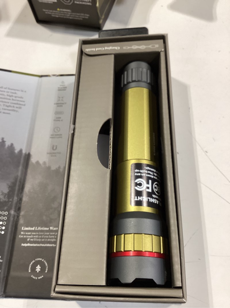 Condition photo showing As Is for swiss tech 5000 lumen rechargeable led flashlight with ip67 waterproof magnetic tailcap