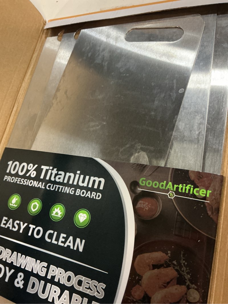 Condition photo showing Good Condition for titanium cutting boards set of 3, 100% pure titanium kitchen cutting board, double-sided non-toxic cutting board, ideal for slicing and dicing meats, features handle, dishwasher safe silver 16"l*10"w(s+m+l)