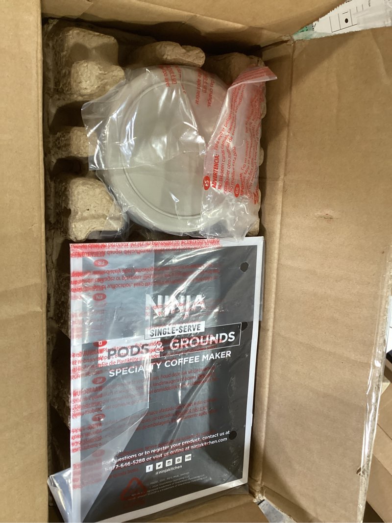 Condition photo showing New/Like New for ninja pod & grounds specialty single-serve coffee maker, k-cup pod compatible, brews grounds, compact design, built-in milk frother, 56-oz. reservoir, 6-oz. cup to 24-oz. mug sizes, stone, pb051st