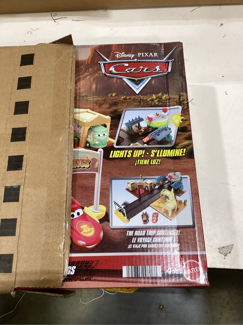 Condition photo showing New/Like New for Mattel Disney and Pixar Cars On The Road Playset with 2 Toy Vehicles & Light-Up Countdown, Includes Lightning McQueen & Mater Truck