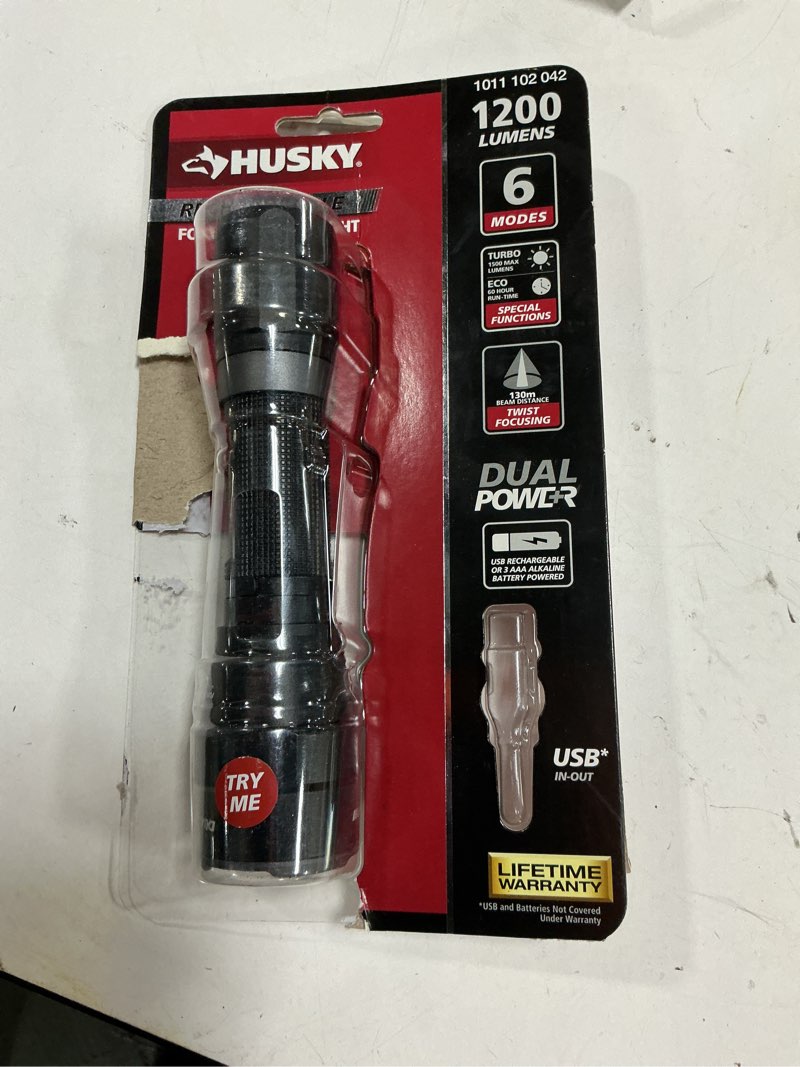 Condition photo showing As Is for new - 800 lumens dual power led rechargeable focusing flashlight w/ recharge