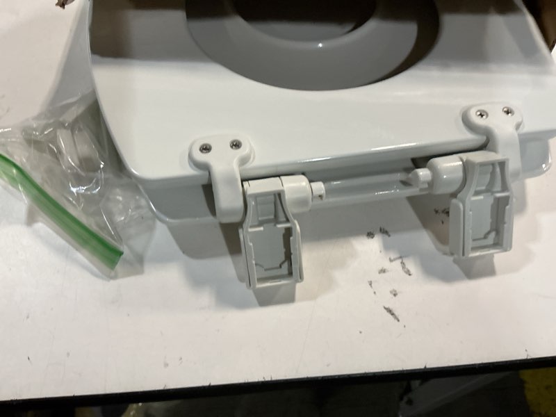 Condition photo showing As Is for Mayfair NextStep2 Toilet Seat with Built-In Potty Training Seat, Slow-Close, Removable that will Never Loosen, Elongated, White Elongated (1-Pack) 1-Pack