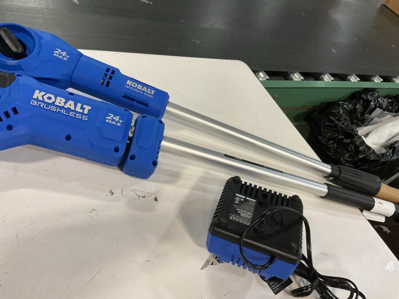Condition photo showing As Is for kobalt 24-volt 8-in 2 ah electric pole saw battery included , charger included