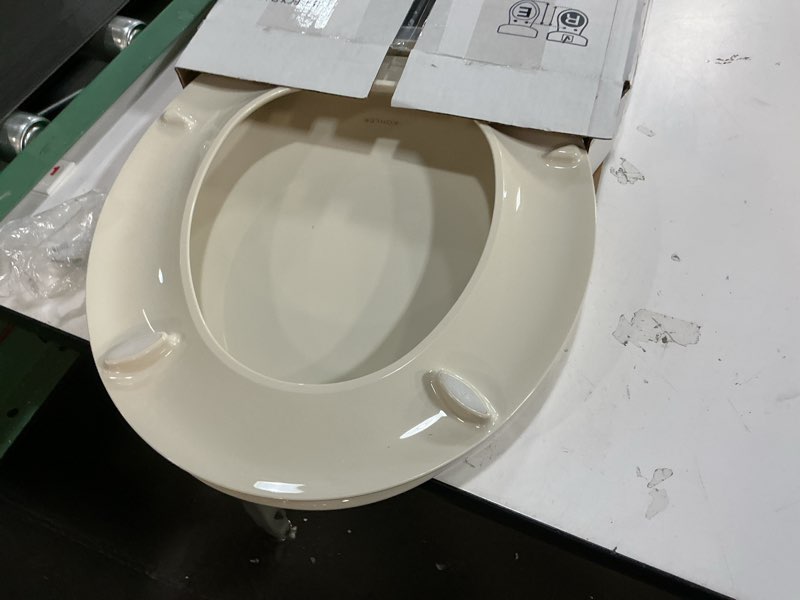 Condition photo showing As Is for KOHLER 4639-RL-47 Cachet ReadyLatch Round Toilet Seat Soft Close, Almond Almond Round Ready Latch