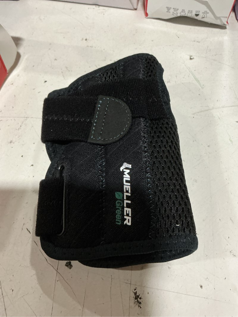 Condition photo showing Good Condition for mueller sports medicine green fitted wrist brace, left, osfm, black
