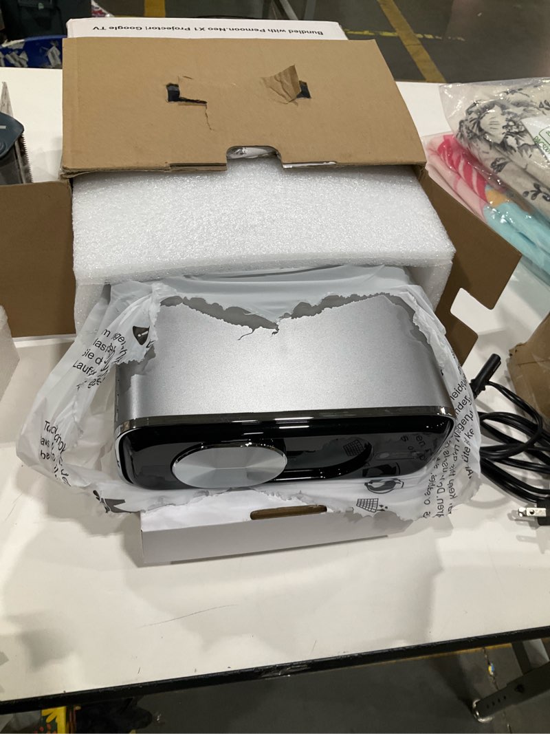 Condition photo showing Good Condition for smart 4k projector [bundled with google tv stick] with wifi and bluetooth, 2500ansi, auto lens cap, portable outdoor movie projector with built-in apps auto focus for ceiling/home theater/bedroom black & gray