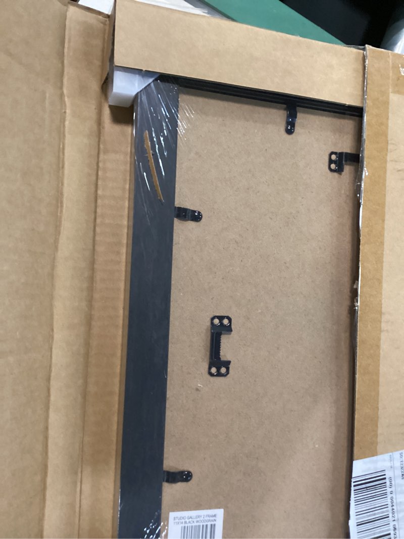 Condition photo showing New/Like New for mcs studio gallery classic 11x14 picture frame black woodgrain engineered wood, vertical & horizontal wall hanging large picture frame for photos & art prints (1-pack) 1-pack 11x14 black woodgrain