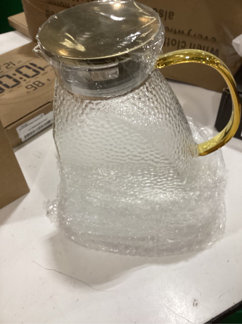 Condition photo showing Good Condition for glass pitcher with lid and spout, 1.8 l/60 oz clear fridge door jug, borosilicate glass bottle with handle and stainless steel lid, hot & cold beverage pitcher for iced tea, coffee, juice, milk