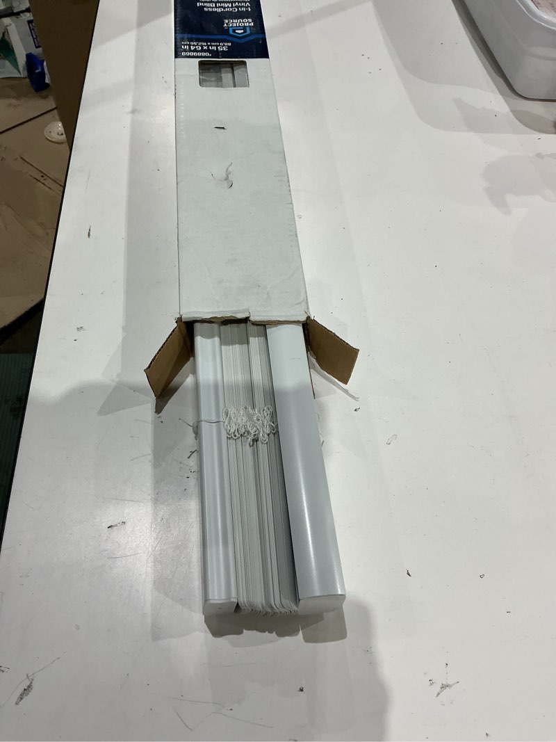 The product is a Project Source cordless vinyl mini blind, model number 42834, designed for a 35 in x 64 in opening.