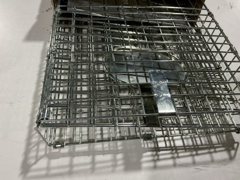 Condition photo showing As Is for SZHLUX 32" Live Animal Cage Trap, Heavy Duty Folding Raccoon Traps, Humane Cat Trap for Stray Cats, Raccoons, Squirrel, Skunk, Mole, Groundhog, Armadillo, Rabbit, Catch and Release SZ-HXL8130-NEW