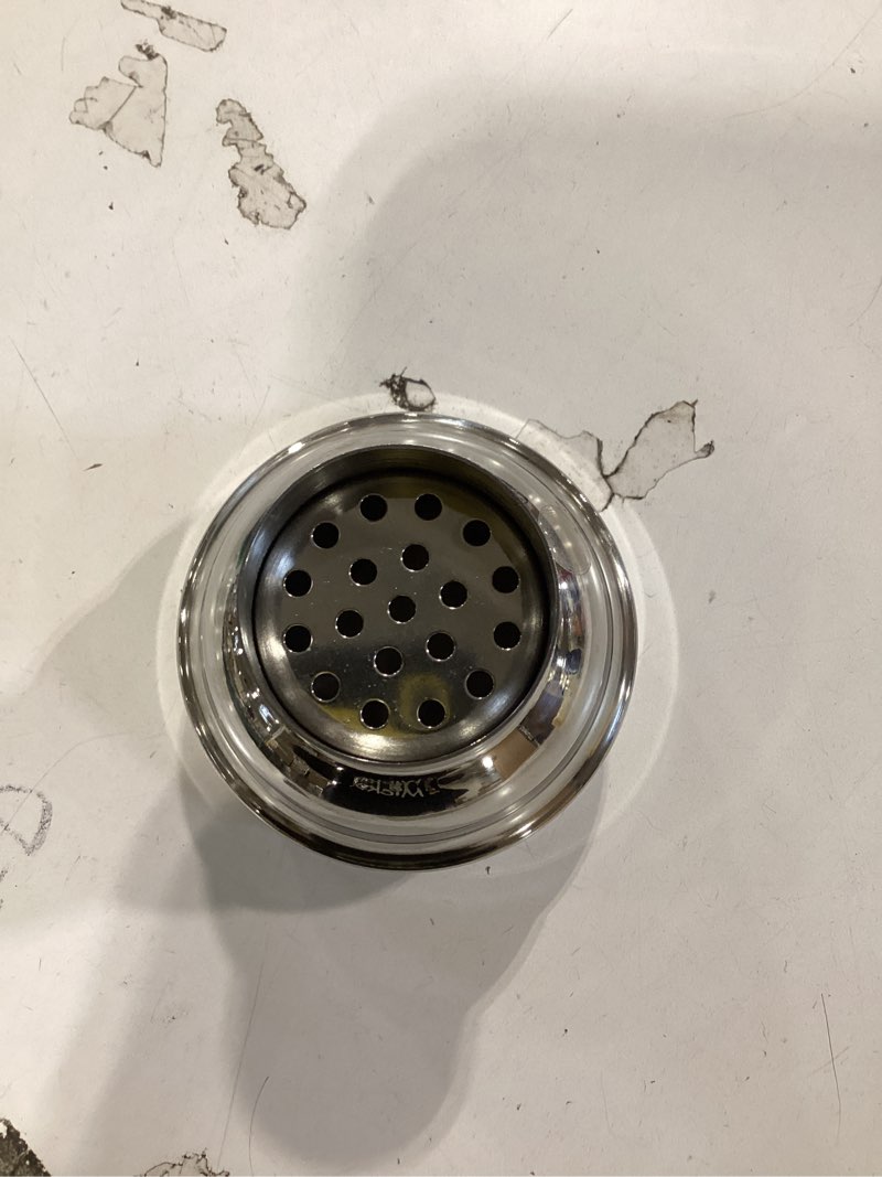 stainless steel, 3-piece cobbler-style cocktail shaker typically used in home bars for mixing and straining cocktails. 