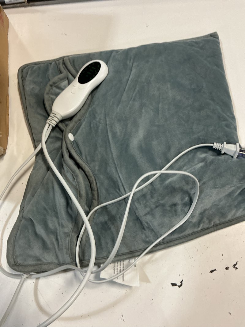 Condition photo showing As Is for foot heating pad fy-hw1616
