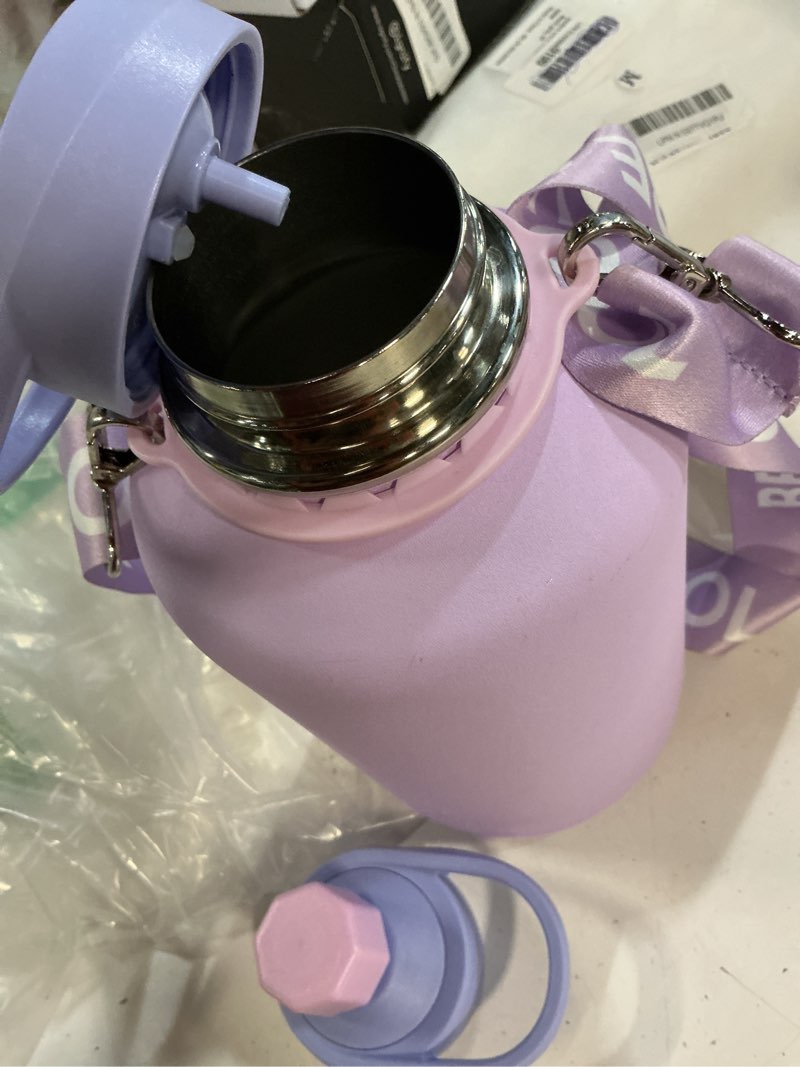 Condition photo showing Good Condition for coolflask half gallon water bottle with strap, 64oz insulated water jug stainless steel with straw & spout lids, metal large water flask, keep cold 48h hot 24h, leak proof & non-bpa, lavender 64 ounces lavender