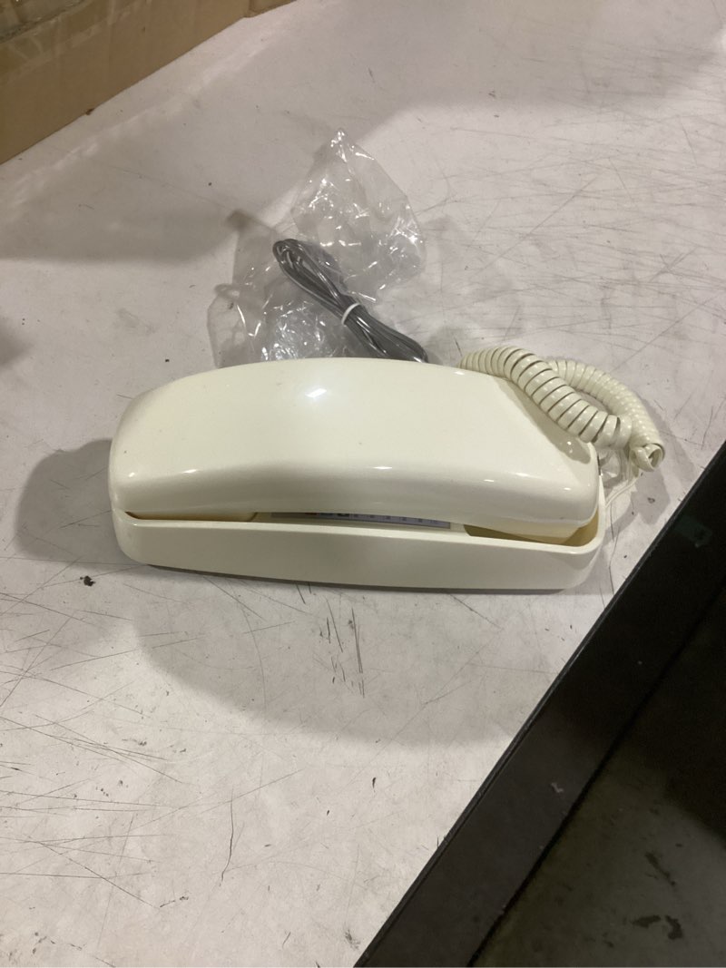 Condition photo showing Good Condition for at&t trimline 210 corded home phone, no ac power required, improved easy-wall-mount, lighted big button keypad, 13 speeddial keys, last number redial, mute, flash, volume control, beige