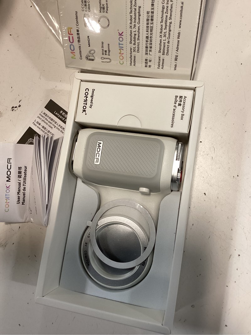 Condition photo showing Good Condition for COMITOK MOCA iPhone 17 Pro Camera Grip No Need App for iOS26, Compatible iOS17 and iOS18, Fun Shot Magnetic Grip for Phone Native Camera with Anti-Drop Detachable Remote and Convenient Keychain Hook White MOCA