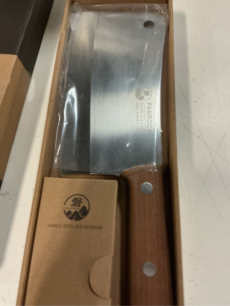 Condition photo showing New/Like New for panrock heavy duty butcher knife, 8" professional bone cleaver with ergonomic handle, premium high carbon steel meat chopper for chopping bone and meat b bone cleaver