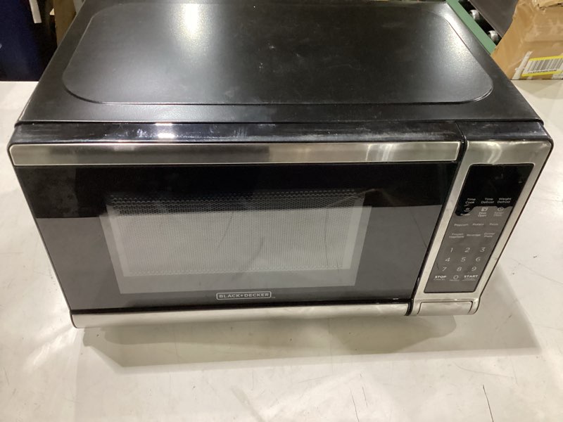 Condition photo showing As Is for **untested** black+decker em720cb7 digital microwave oven with turntable push-button door, child safety lock, 700w, stainless steel, 0.7 cu.ft 0.7 cu. ft.