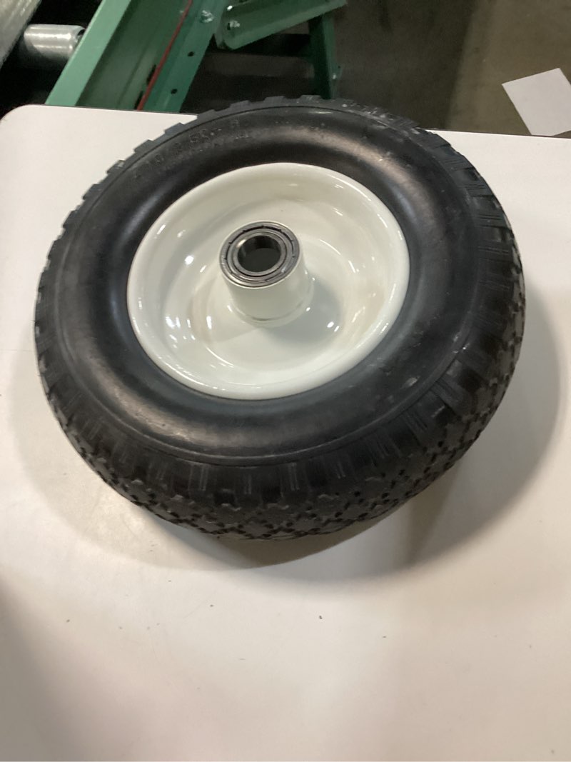 Condition photo showing As Is for 12 in. flat free solid polyurethane all-purpose replacement tire for trailer dollies hand trucks, garden carts, black