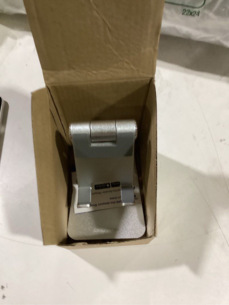 Condition photo showing Good Condition for adjustable cell phone stand, omoton aluminum desktop cellphone stand with anti-slip base and convenient charging port, fits all smart phones, silver