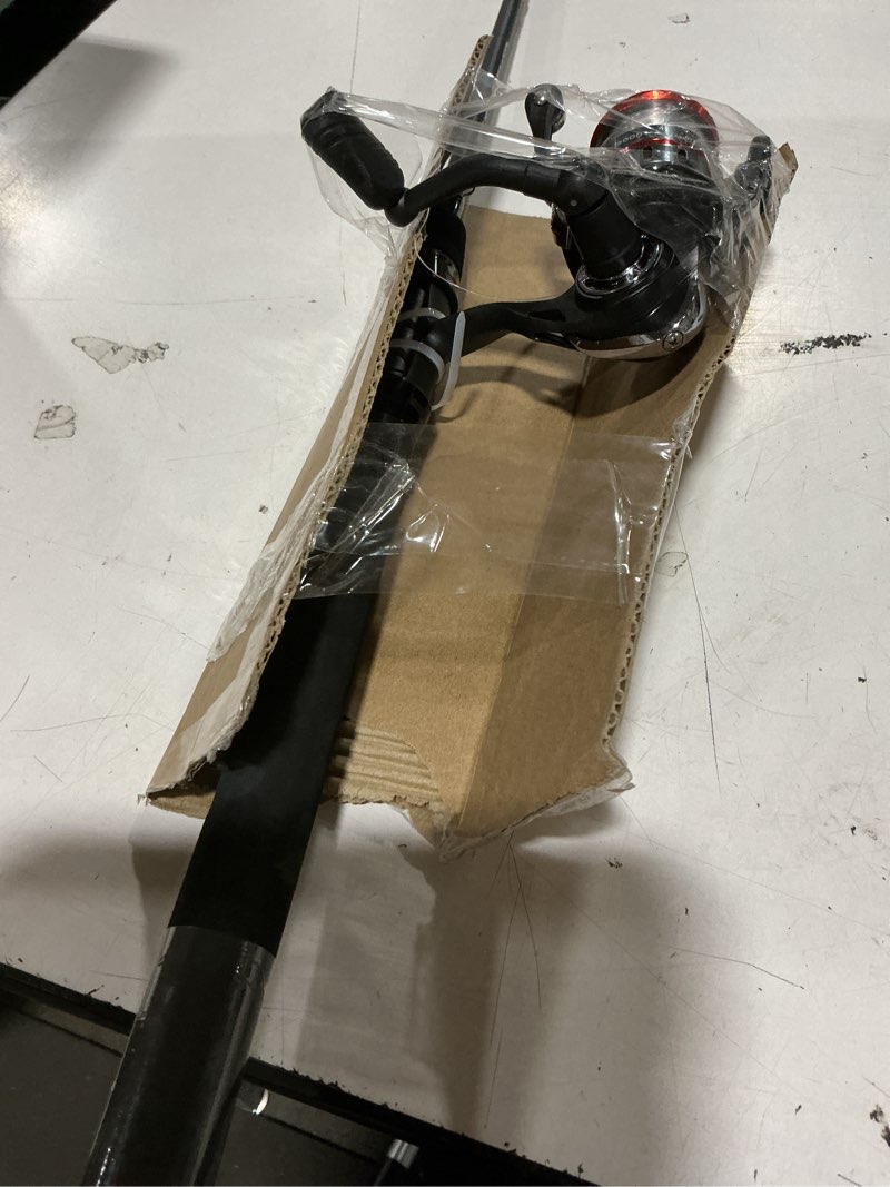 Condition photo showing Good Condition for ozark trail grit stick spinning fishing rod and reel combo, 6-foot 6-inch 2-piece medium action rod, size 3000 reel, left & right hand retrieve, black with orange