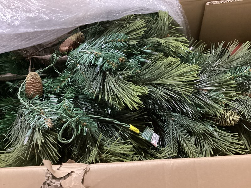 Condition photo showing Good Condition for National Tree Company 7.5 ft Pre-Lit Carolina Pine Artificial Christmas Tree, 750 Clear Lights, 1,399 Tips, Includes Stand, Green 7ft 6in Green