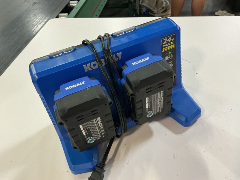 Condition photo showing As Is for kobalt 24v 5.0 ah charging station with 2 batteries
