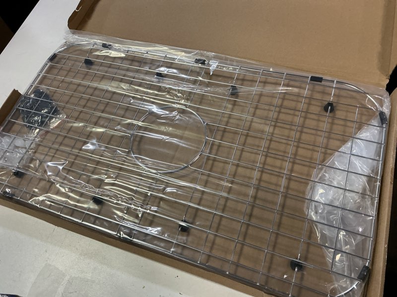 Condition photo showing Good Condition for Serene Valley Sink Protector Grid 26-1/16" x 14-1/16", Centered Drain with Corner Radius 3-1/2", 304 Stainless Steel Material NLW2614C
