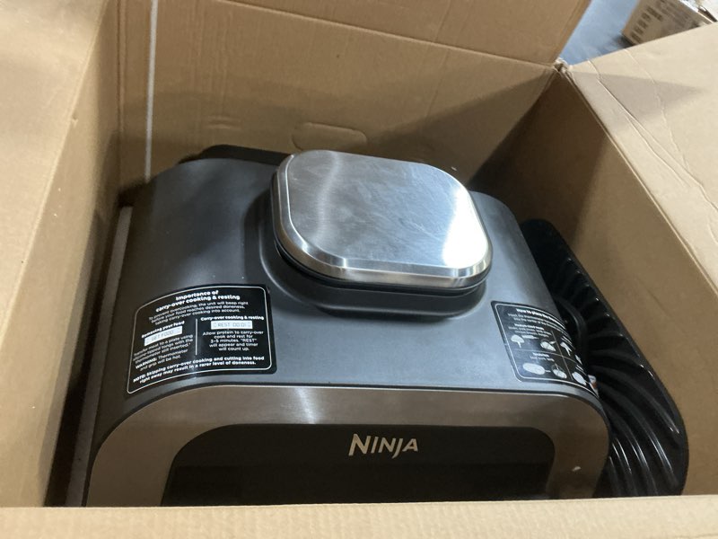 Condition photo showing As Is for ninja dg551 foodi smart xl 6-in-1 indoor grill with air fry, roast, bake, broil, & dehydrate, foodi smart thermometer, 2nd generation, black/silver 6-in-1 with thermometer