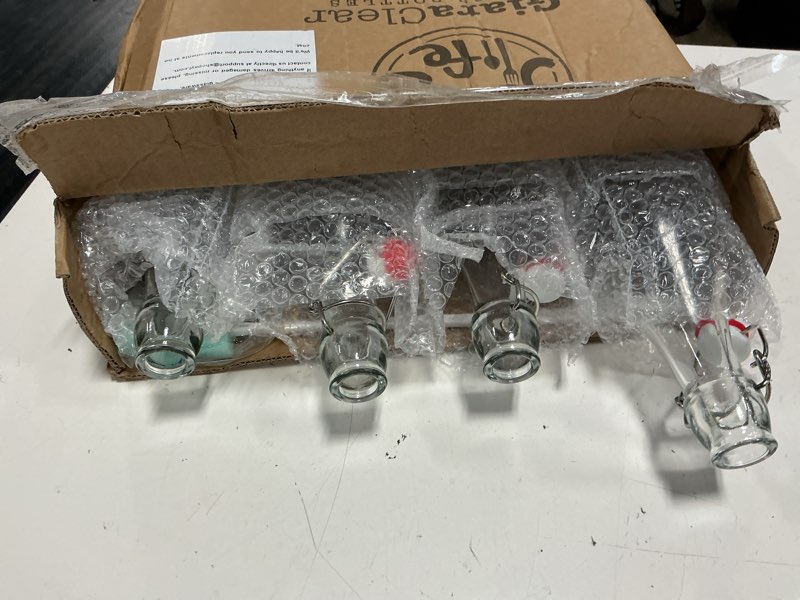 Condition photo showing Good Condition for ayl flip top glass bottle [1 liter / 33 fl. oz.] [pack of 4] – swing brewing bottle with stopper for beverages, oil, vinegar, kombucha, water, soda, kefir – airtight lid & leak proof cap – clear 4 33