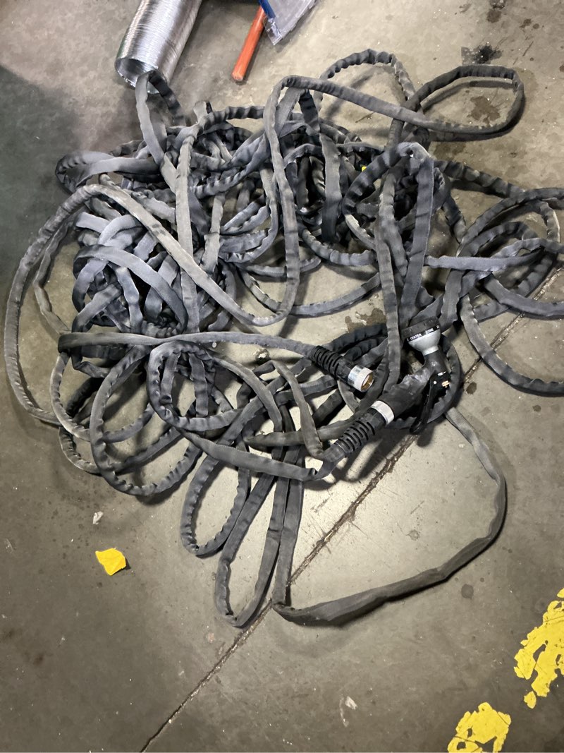 Condition photo showing As Is for zero-g teknor apex 5/8-in x 50-ft premium -duty kink free woven gray hose