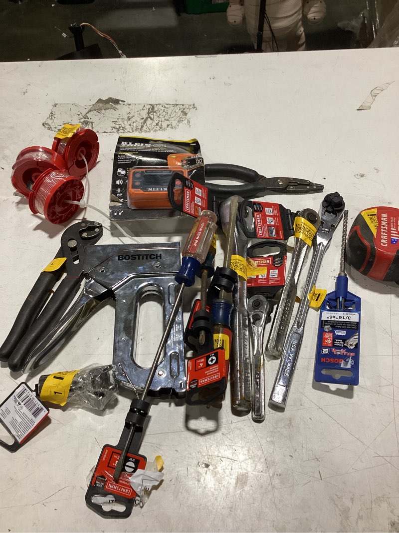 Condition photo showing Good Condition for assorted repair equipment lot: tools,measuring tape, nail gun, angle gauge, etc