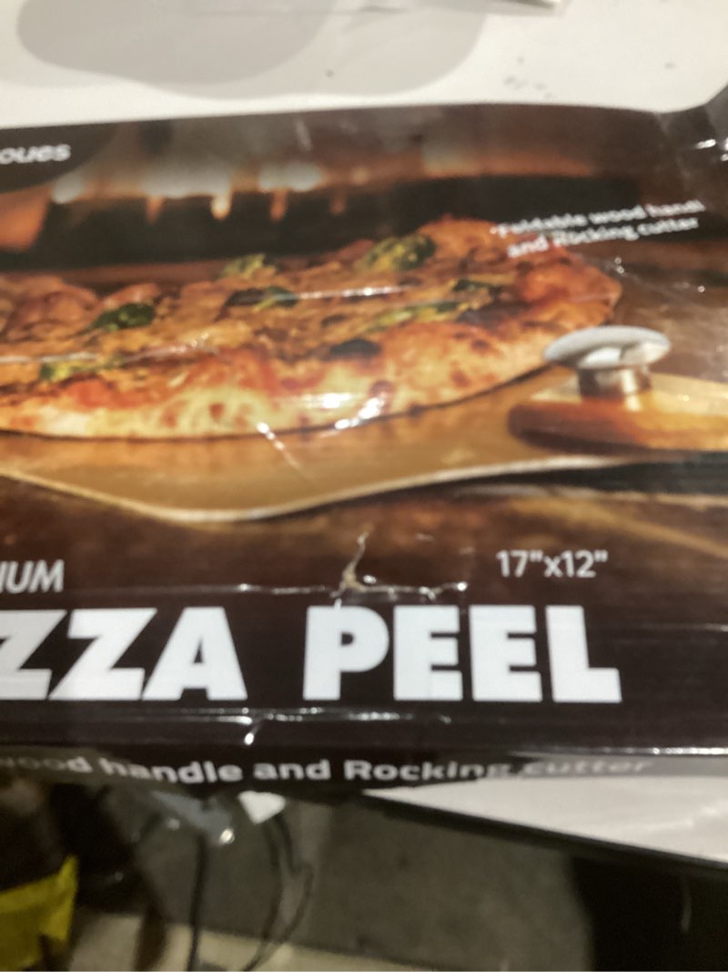 Condition photo showing As Is for Pizza Peel Aluminum Pizza Spatula,17 inch Metal Pizza Paddle(12"x 17") with Rocker Cutter Foldable Wood Handle, [Storage bag included], for Family Pizza Oven Baking Pizza, Dough, Bread & Pastry Pizza Peel 17"x 12" with Rocker Cutter